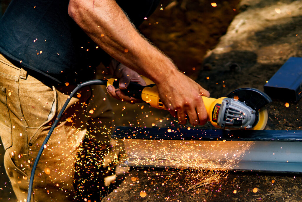 craftsman cutting metal and welding
